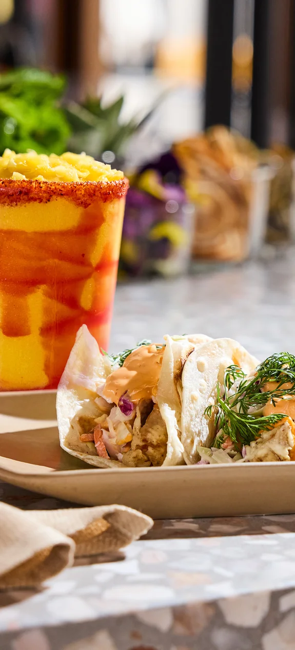 Plate of tacos with a margarita