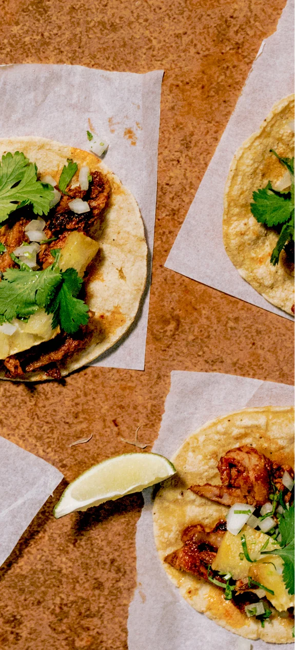 Table with tacos on it