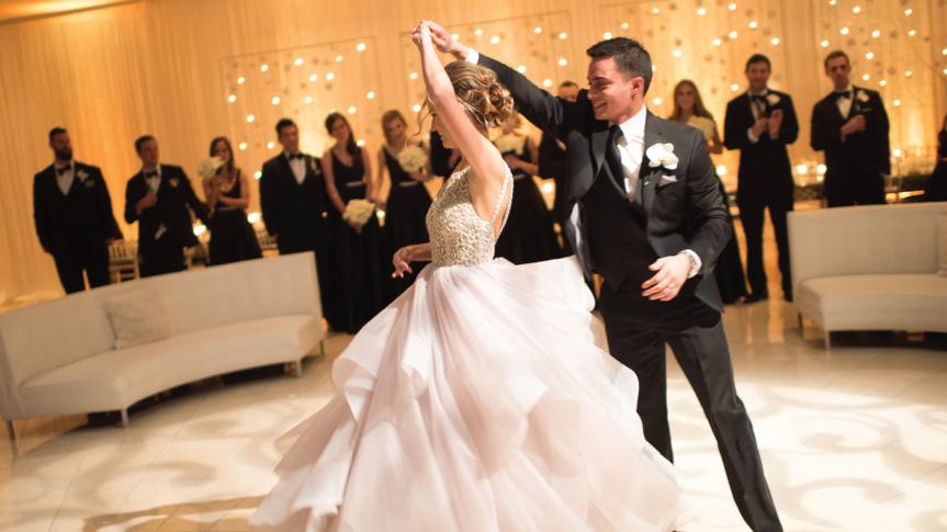 A bride and groom dancing at their wedding