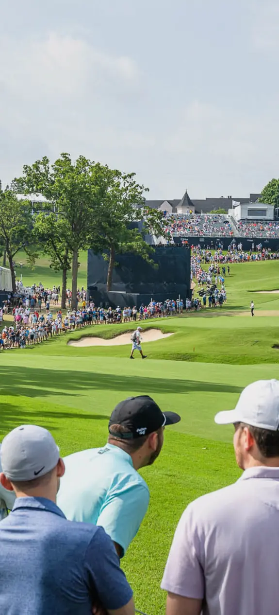 Spectators watching a PGA golf tournament
