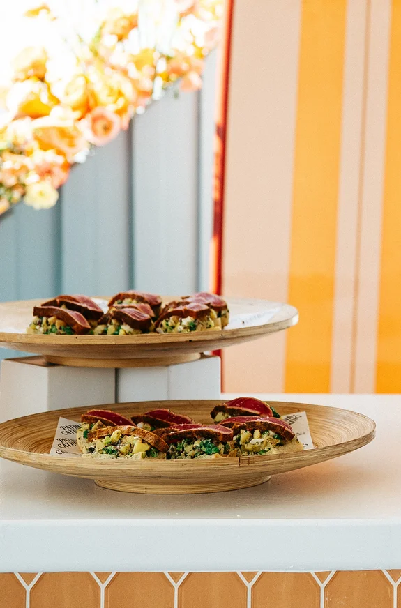Colorful tacos on wooden platters.