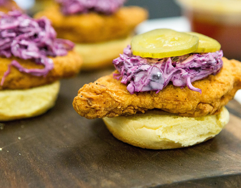 Fried chicken sandwich with red cabbage slaw and pickle