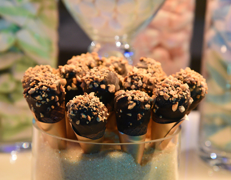 Ice cream cones with chocolate fudge and peanuts