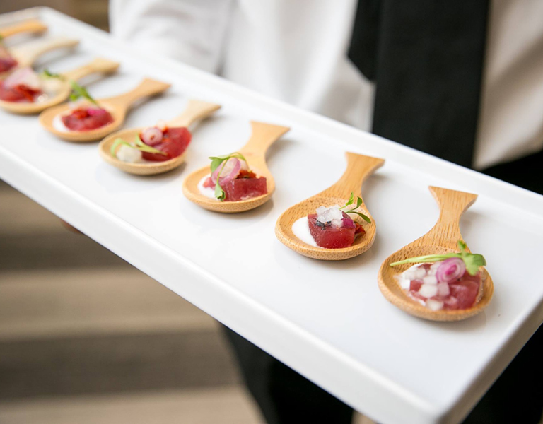 Wedding appetizers served on wooden spoons