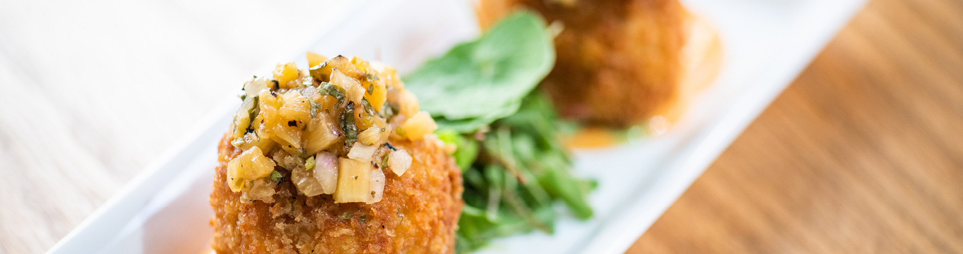 Crab cakes served at Tangata Restaurant in Orange County